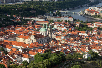 Naklejka na ściany i meble View of St. Nicholas Church and Mala Strana District (Lesser Town) in Prague, Czech Republic, from above.