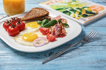 Delicious breakfast with over easy eggs on kitchen table