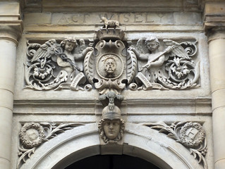 ornate stone carving above the main door of halifax town hall in yorkshire