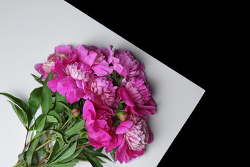 Beautiful bouquet with fragrant peonies on light table