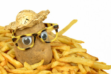 potato with straw hat and glasses in a pile of golden french fries