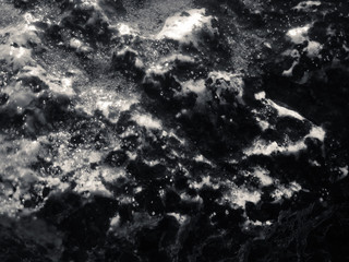 Macro closeup on surface of the rock stone dark background
