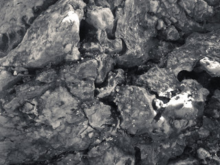 Macro closeup on surface of the rock stone dark background
