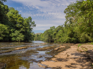 Obraz premium The Lower Falls, Aysgarth waterfalls on beautiful summers day at Aysgarth, Leyburn, North Yorkshire, UK