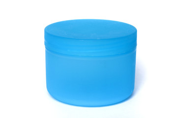 Blue plastic pot for cosmetic product packaging isolated on white background