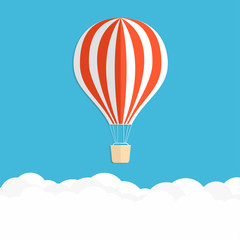 Obraz premium Hot air balloon in the sky. Red striped air balloon above clouds