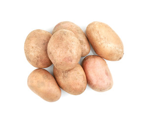 Raw unpeeled potatoes on white background