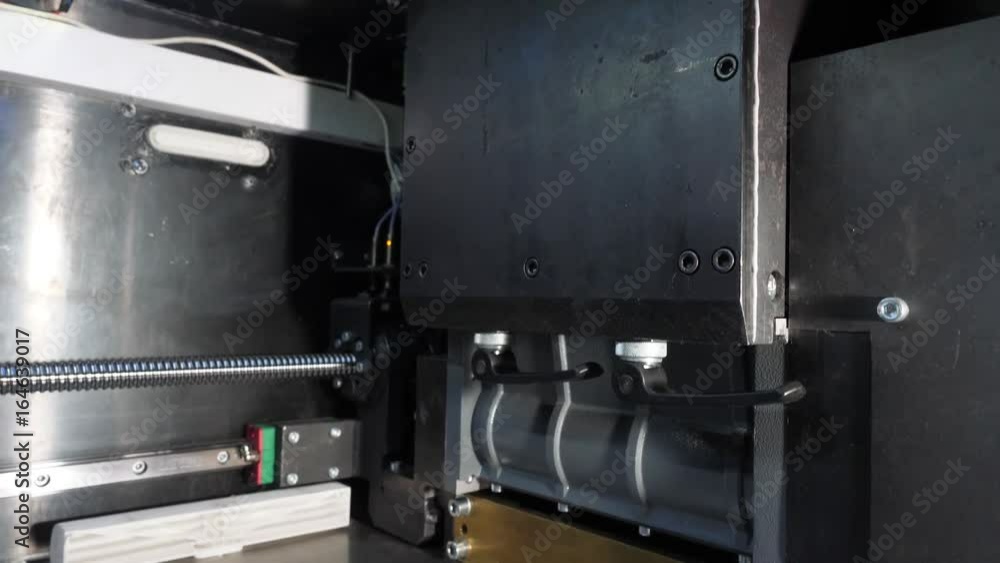 Poster close up of 3d printer operating in design studio. electronic three dimensional plastic printer duri