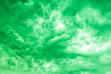 texture with dramatic green storm clouds on background