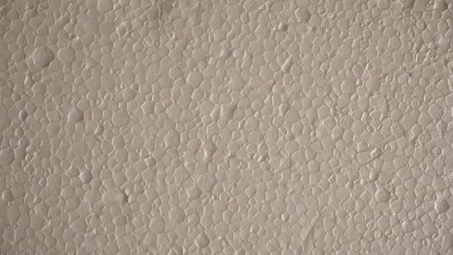 White polystyrene foam surface background texture. Dolly sliding shot 4K ProRes HQ codec