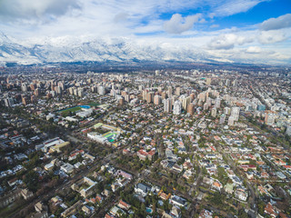 Obraz premium Aerial drone shot of Santiago de Chile at winter. Snowy cityscape of the city