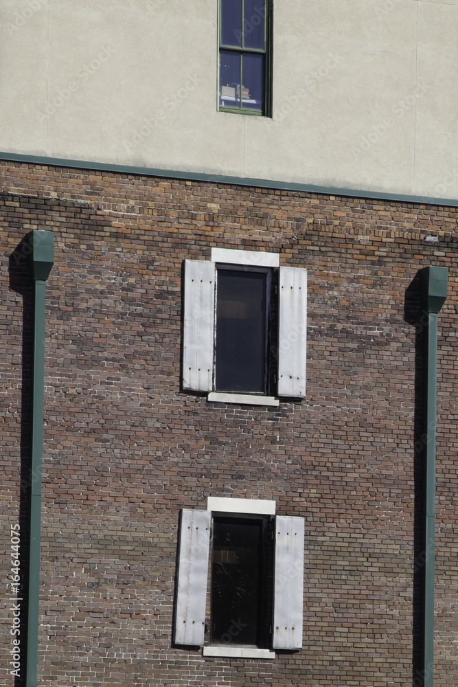 Wall mural two windows in a brick wall