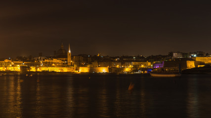 Night cityscape of Valletta seen from Sliema waterfront, Malta