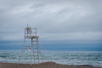 Lifeguard chair on sandy beach in Milwaukee, Wisconsin