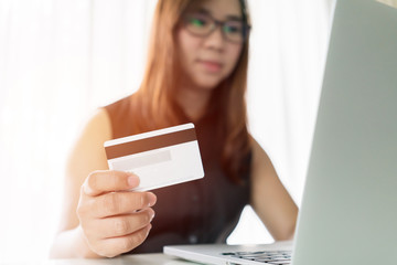 woman hand holding credit and online shopping activity