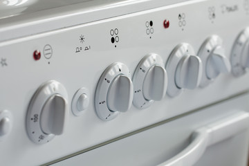 Close Up Of Knobs Switch Of White Gas Stove.
