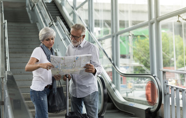 Senior couple tourists traveling city