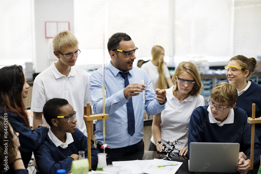 Wall mural group of students laboratory lab in science classroom