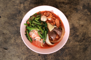 pink seafood flat noodle (Tom Yum Yen-Ta-Fo)