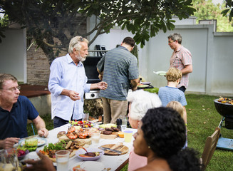 Group of diverse people enjoying barbecue party together