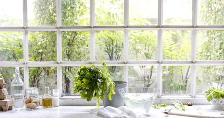 Eggs and washed vegetable by the glass window