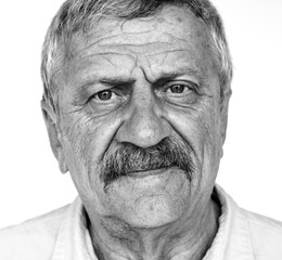 Senior adult man moody casual studio portrait