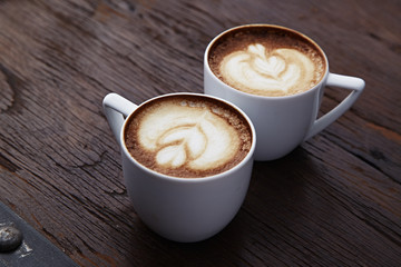 Two white cups of coffee