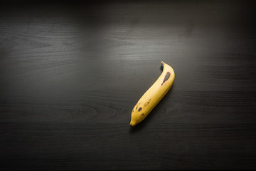 banana on black wood background