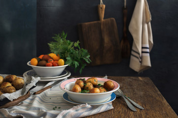 Plate with new fried potatoes and fresh home-made vegetables