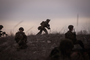 Soldiers from US Navy Amphibious Squadron 8 assault an enemy strong point during a NATO military...