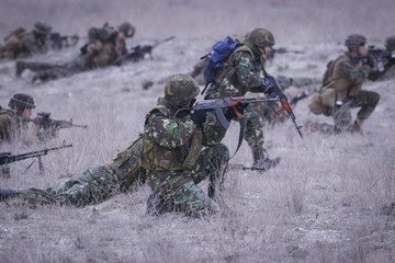 Soldiers from US Navy Amphibious Squadron 8 assault an enemy strong point during a NATO military exercise