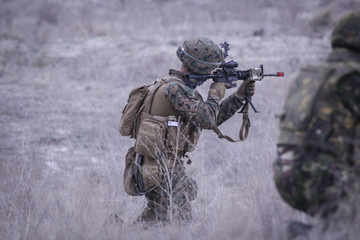 Soldiers from US Navy Amphibious Squadron 8 assault an enemy strong point during a NATO military exercise