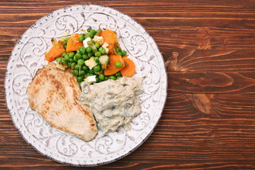 Turkey fillet with mushrooms in cream sauce and vegetables
