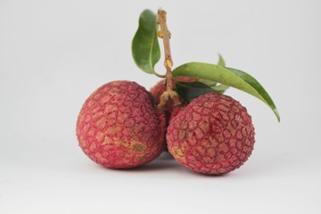 lychee berries and leaves on a white background. litchi,lichi
