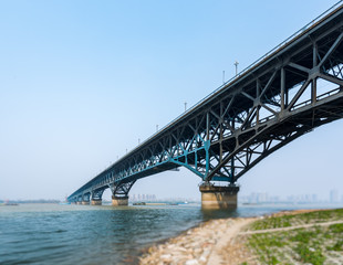 Long bridge across river in city of China.