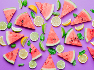 cutted lemons and limes with watermelon