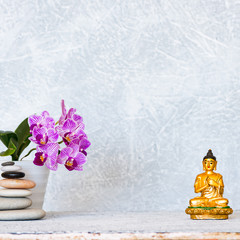 Buddha, pyramid of pebbles and orchid flower as zen background