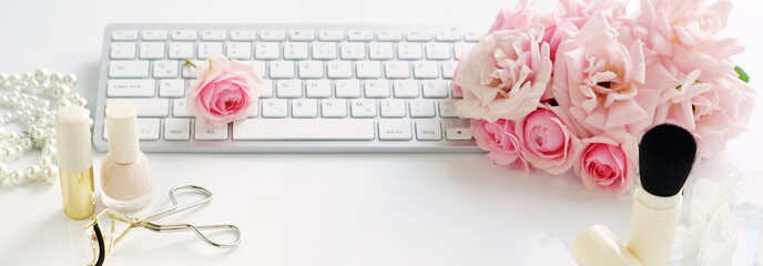 Flat lay, top view office feminine desk, female make up accessories, workspace with laptop and bouquet roses.Beauty blog concept.Banner - obrazy, fototapety, plakaty
