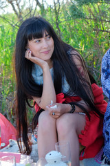 Young woman enjoying picnic with friends