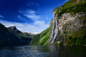 Fototapeta na wymiar Scenic view of Fjord with waterfalls