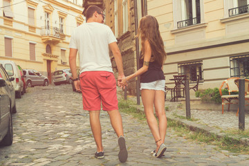 Couple in love holding hands.