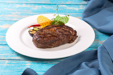 Beef steak on a wooden board