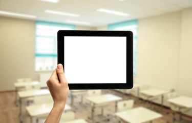 Female hand holding tablet isolated on white