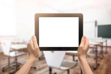 Female hands holding tablet isolated on white