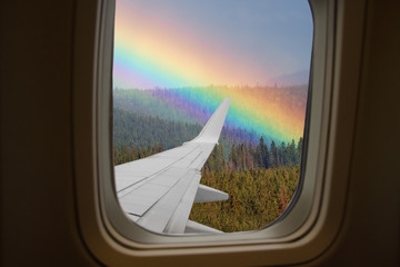 View from airplane window on rainbow