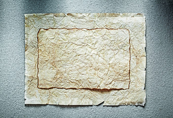 Vintage crumpled manuscripts on grey surface top view