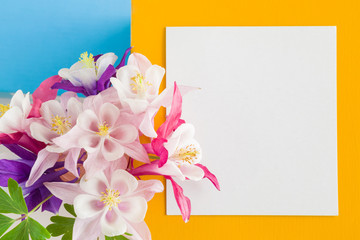 White blank greeting card with flowers. Empty place for a text.
