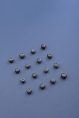 Blueberries isolated over blue background table.
