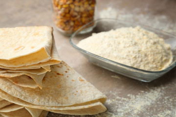Composition with yummy tortillas on kitchen table