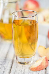 Apple Cider on wooden background (selective focus)